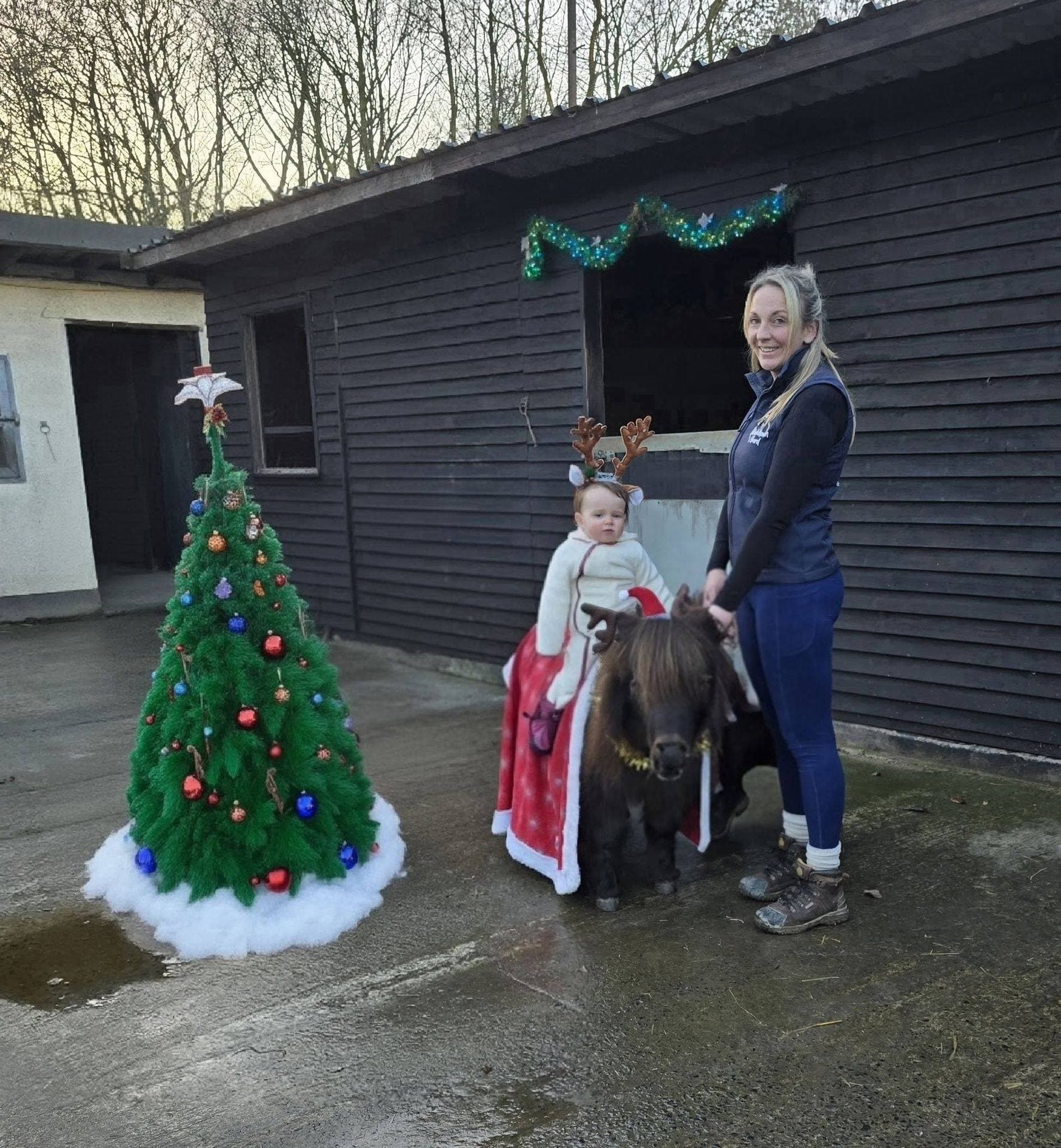 Emily and a child on a Shetland pony, festive Christmas styling